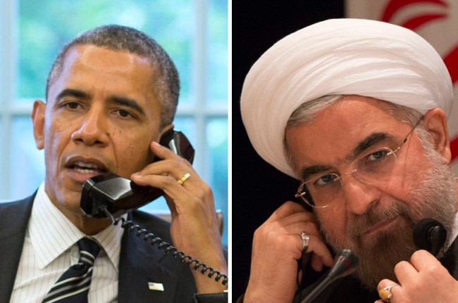 U.S. President Barack Obama talks with Iranian President Hassan Rouhani during a phone call in the Oval Office at the White House in Washington September 27, 2013. REUTERS/Pete Souza
