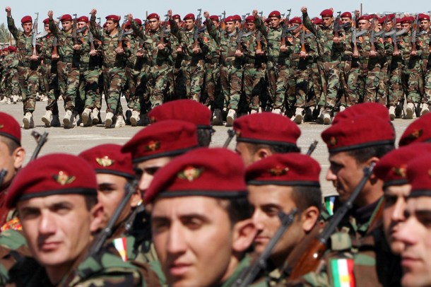 Kurdish Peshmerga soldiers parade during their graduation ceremony in the northern Kurdish city of Erbil on March 2, 2010. (Photo credit should read SAFIN HAMED/AFP/Getty Images)