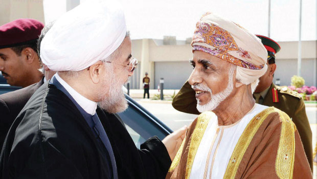 Iranian President Hassan Rouhani (left) and Sultan Qaboos of Oman