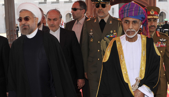 Oman's Sultan Qaboos bin Said (R) walks with Iran's President Hassan Rouhani upon Rouhani's arrival in Muscat March 12, 2014. REUTERS/Sultan Al Hasani (OMAN - Tags: POLITICS ROYALS) - RTR3GQAH