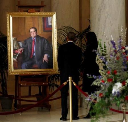 U.S. President Barack Obama and Michelle Obama view portrait of late Supreme Court Justice Scalia at the Supreme Court in Washington