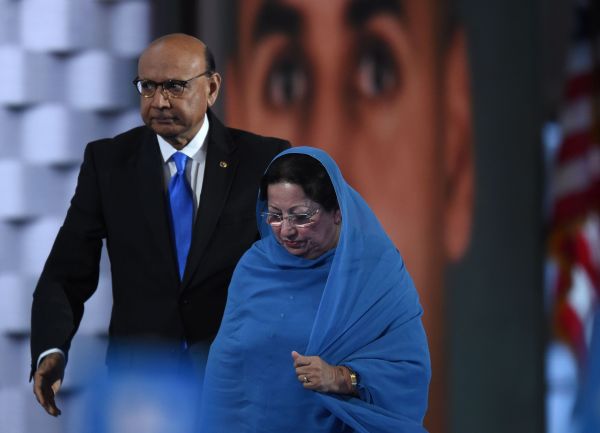 Khizr Khan, father of Humayun S. M. Khan who was killed while serving in Iraq with the US Army, leaves the stage with his wife looks on during the fourth and final day of the Democratic National Convention , (Photo credit TIMOTHY A. CLARY/AFP/Getty Images)